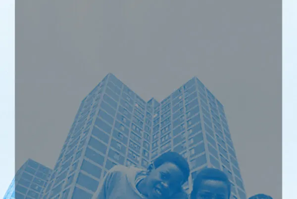 Two figures in front of a Chicago high-rise, tinted blue.