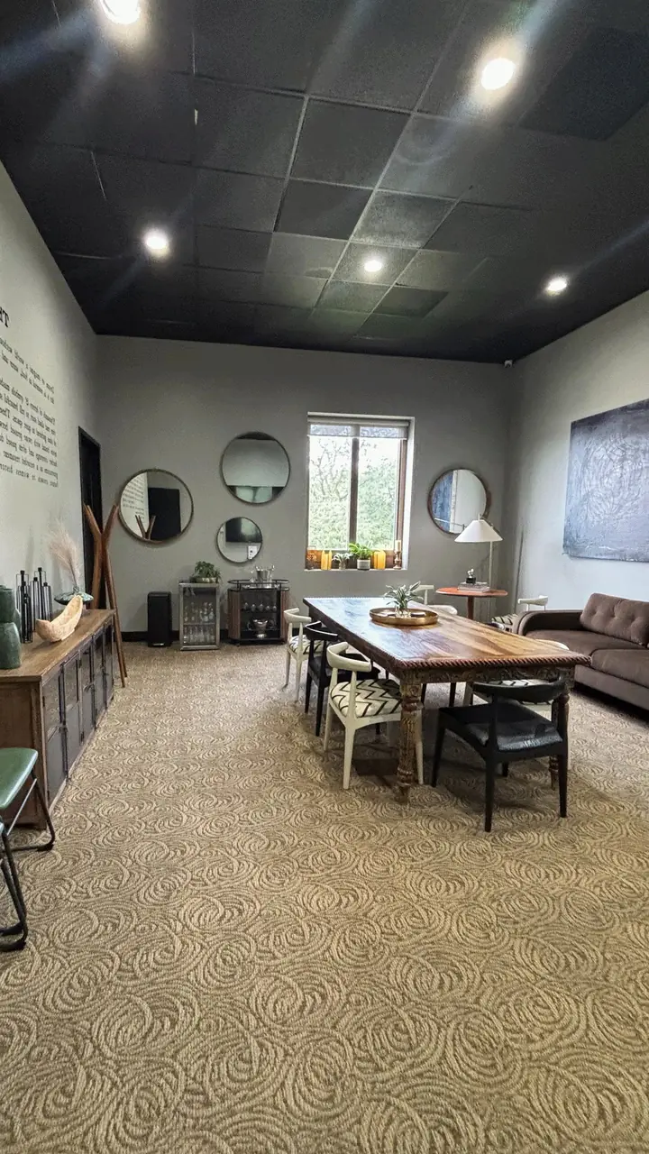 The Writer’s Room seen lengthwise, with mirrors and a long conference table